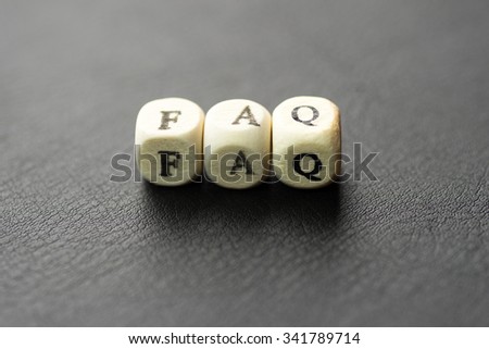 Wooden blocks with the text, FAQ on the black background