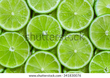 Lime slices background Royalty-Free Stock Photo #341830076