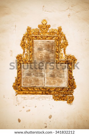 Gold vintage frame on wall