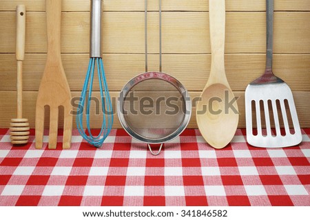  Cooking Utensils on Red Checkered Tablecloth and Wooden Planks