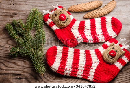 Christmas stocking pine cones and branches. Christmas decorations on wooden rustic background close up, copyspace,horizontal photo