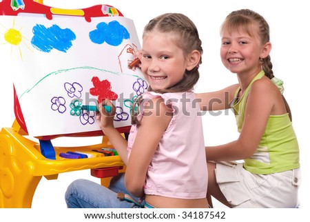 Beautiful girls play on a white background