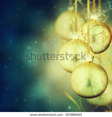Hanging gold christmas balls with copy space.