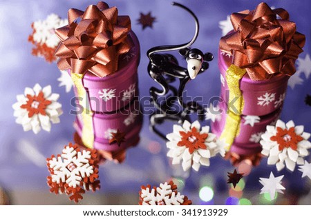 Christmas gifts, monkey and red and white snowflakes on a blue background.