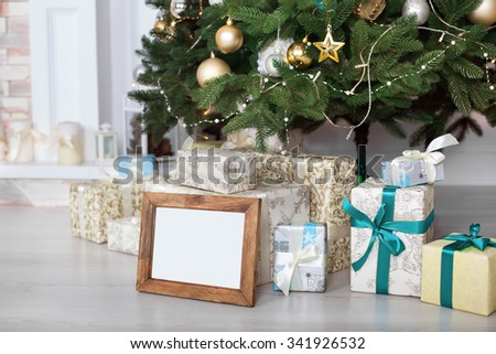 Christmas gifts under the Christmas tree Royalty-Free Stock Photo #341926532