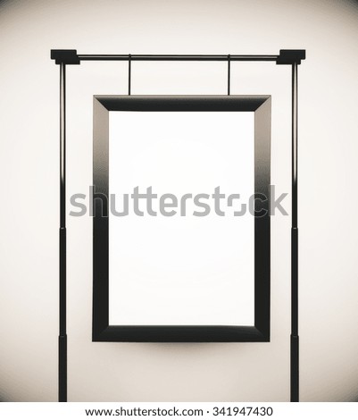 Blank picture frame at white wall background, mock up