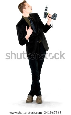 Serious Caucasian young man with short light blond hair in business formal outfit holding power tool - Isolated