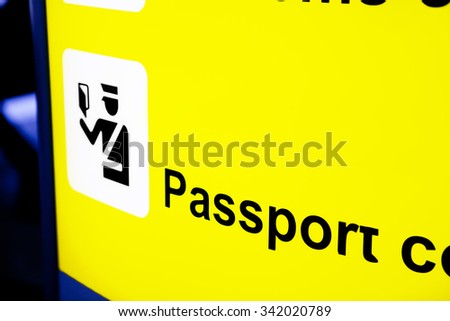Airport Sign Pointing to Passport Control Area