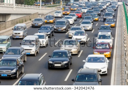 modern city traffic jam in the rush hour??Fuzzy automotive background
