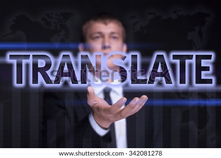Businessman holding on the right hand a glowing text "Translate". Business concept. Internet concept