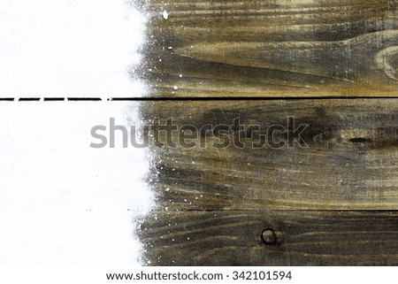 White snow border on antique rustic wood background