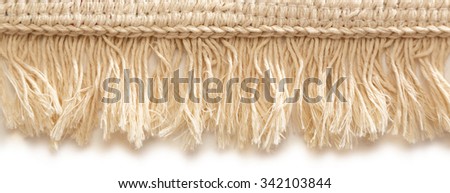 Small bathroom carpet of rough textile with fringe Royalty-Free Stock Photo #342103844