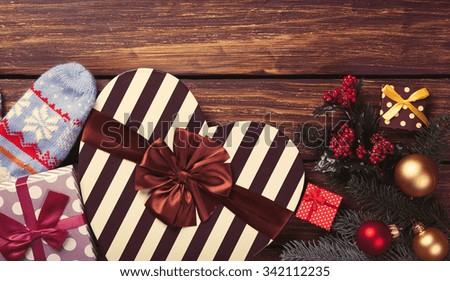 christmas gifts on wooden background