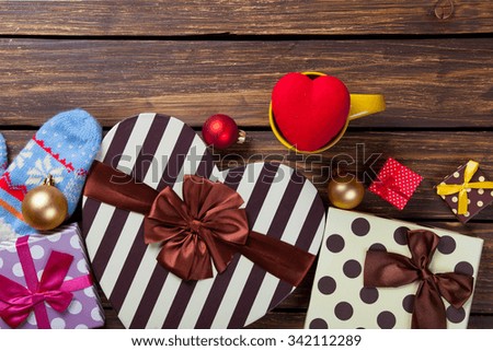 heart shape toy and christmas gift on wooden background