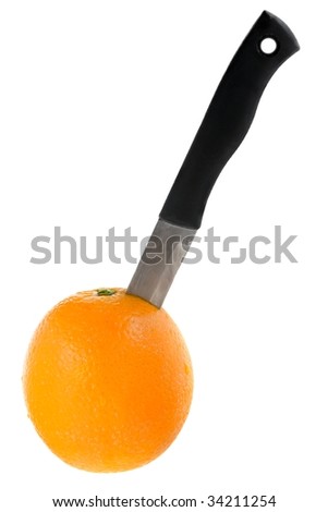 Fresh orange with a inserted knife isolated on a white background