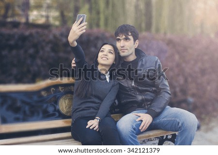  young couple on the bench selfie
