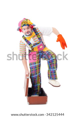 handsome young clown with the guitar and trunk