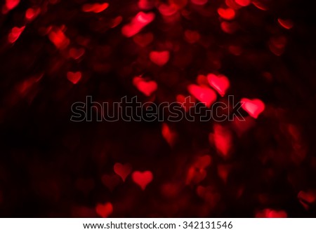 Red hearts bokeh, dark background