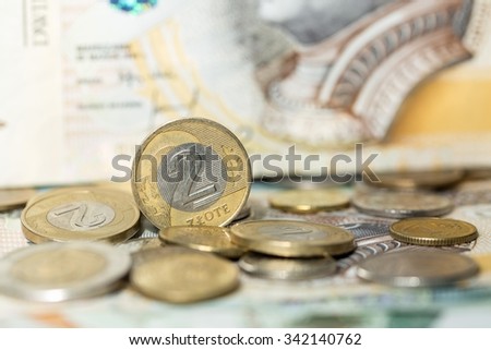 Polish zloty in notes and coins, photograph with depth of field.