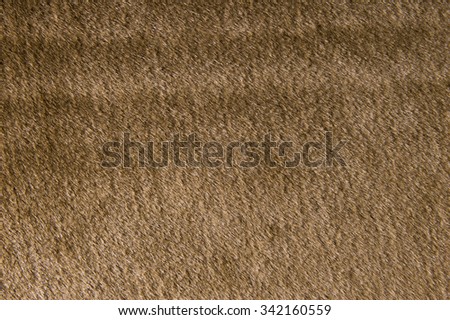 Synthetic fur brown background.