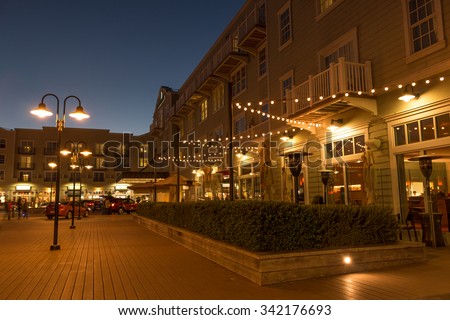 MONTEREY, CALIFORNIA, UNITED STATES, November 21, 2015: A night time scene of the Intercontinental Clement Hotel on Cannery Row Royalty-Free Stock Photo #342176693