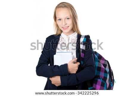 Portrait of cute happy beautiful girl wearing school uniform, holding stack of books and checkered bag, isolated studio shot, white background