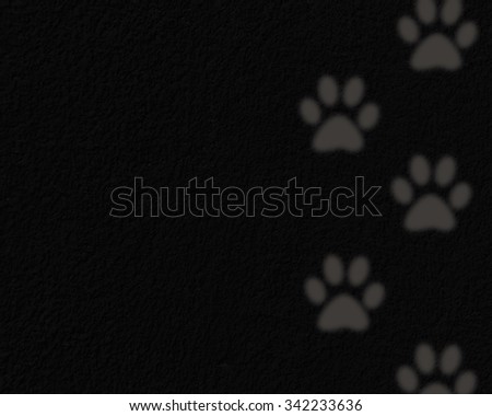 Animals footprints on a black background