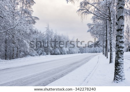 Snowy motor road Royalty-Free Stock Photo #342278240