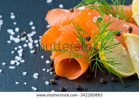 Smoked Salmon with Lemon and Dill selective focus Royalty-Free Stock Photo #342280883