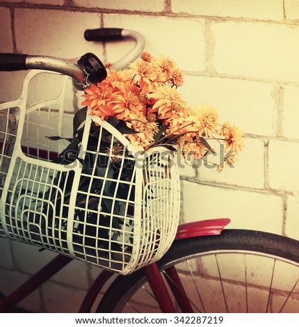 Vintage Bicycle with flowers (toned picture)