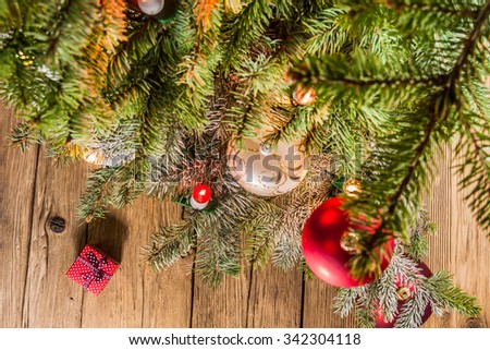 Christmas gifts on a table with old wooden planks
