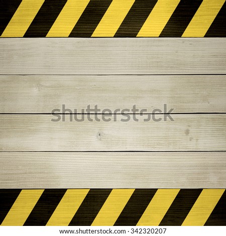 Under Construction / Black and Yellow Hazard Stripes Painted on Wooden Planks