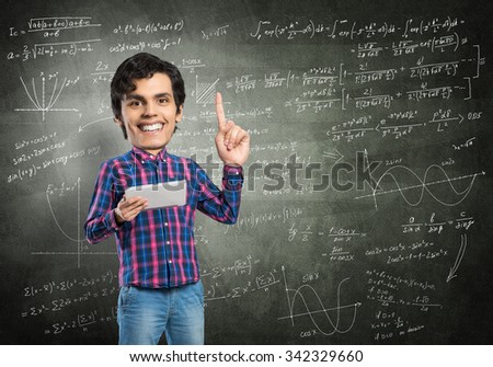 Funny bigheaded student with tablet in hands pointing with finger up