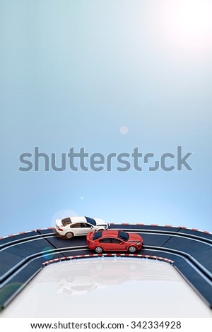 A studio photo of a slot car race set
