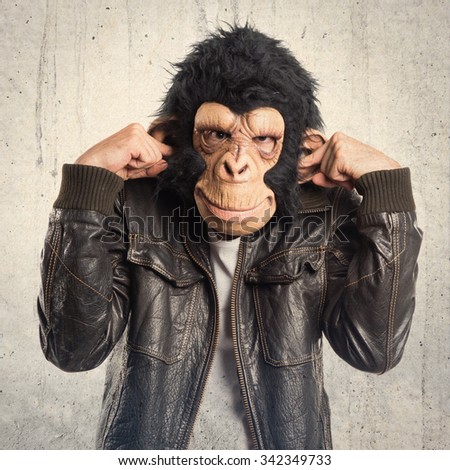 Monkey man covering his ears