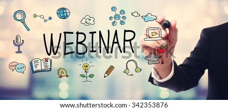 Businessman drawing Webinar concept on blurred abstract background 
