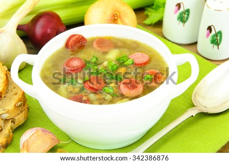 Healthy and Diet Food: Soup with Lentils and Sausage. Studio Photo