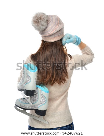 Young woman back ice skates for winter ice skating sport activity in hat standing backward isolated on a white background