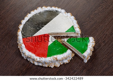 The symbol of war and separatism: a cake with a picture of the flag ofPalestine is broken into pieces