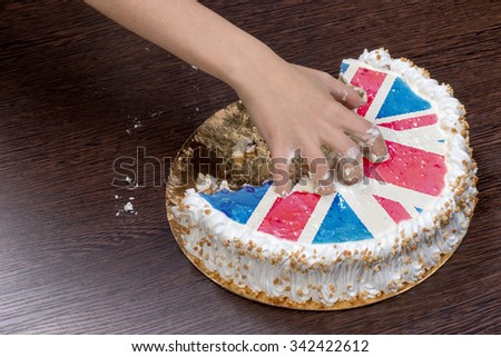 The symbol of war and separatism: a cake with a picture of the flag of Great Britain is broken into pieces