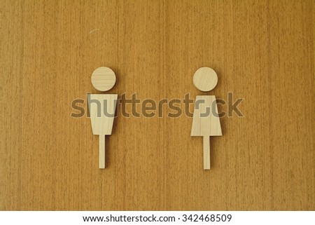 man and woman icon, isolated, wood on the wood background
