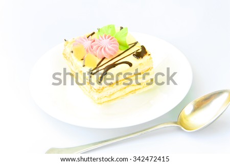 Sweets: Cream Cakes on Plate. Studio Photo