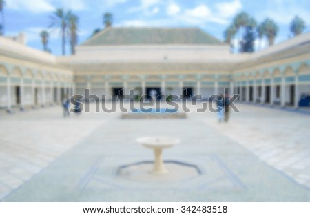 Defocused background of a courtyard in Marrakech, Morocco. Intentionally blurred post production for bokeh effect