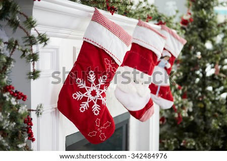 Empty Stockings Hung On Fireplace On Christmas Eve Royalty-Free Stock Photo #342484976