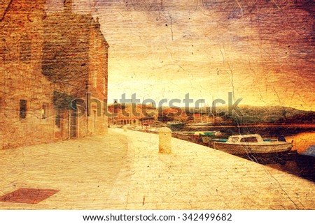 empty quay of mediterranean town Starji Grad at sunset (Croatia, Hvar). Picture in artistic retro style.