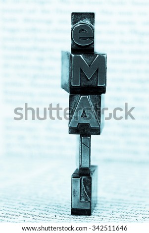 the word "e-mail" in lead letters written. photo icon for quick correspondence