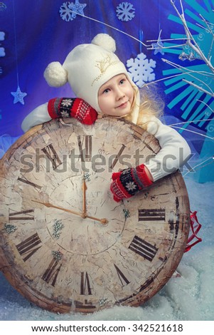 Cute little girl in winter wear happy about new year