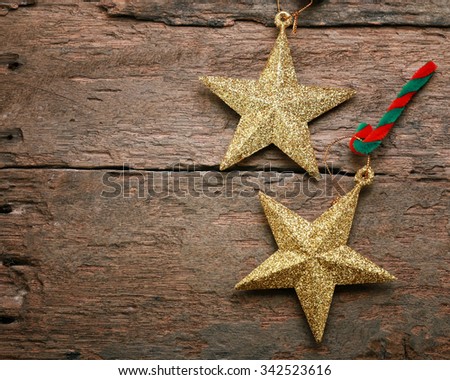 Christmas present and gold star on dark wooden background - vintage style