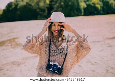 Smiling Retro Girl With Camera