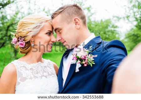 Beautiful young wedding couple outside in nature